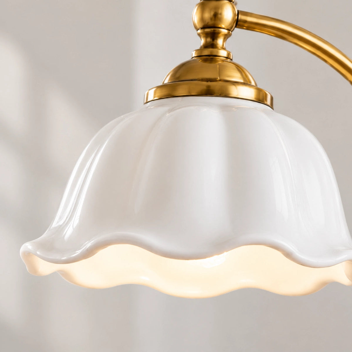 Ceramic Flower Shade Table Lamp — scalloped white shade and curved brass-colour stem